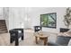 Bright living room with modern furniture, wood floors, and a large window at 4933 S Xenon Ct, Morrison, CO 80465