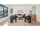 Bright living room with modern furniture, wood floors, and contemporary decor at 4933 S Xenon Ct, Morrison, CO 80465