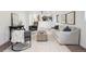 Living room featuring gray armchairs, light colored carpet and furniture, and wall art at 4933 S Xenon Ct, Morrison, CO 80465