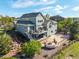 Aerial view of a landscaped backyard complete with multi-tiered patio areas and water feature at 11857 S Saunter Ln, Parker, CO 80138