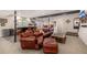 Spacious basement featuring a wet bar, leather seating, and an inflatable play area at 11857 S Saunter Ln, Parker, CO 80138