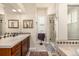 Bathroom with a vanity, walk-in shower, and tile floor at 11857 S Saunter Ln, Parker, CO 80138