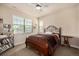 Comfortable bedroom with soft carpet and a large window at 11857 S Saunter Ln, Parker, CO 80138