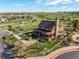 Aerial view of community clubhouse featuring outdoor seating and well-maintained grounds at 11857 S Saunter Ln, Parker, CO 80138