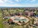 An aerial view shows the community pool with water slides, a splash pad, and plenty of room to play at 11857 S Saunter Ln, Parker, CO 80138