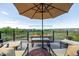 Enjoy outdoor living on this expansive deck with a cozy fireplace and stunning views at 11857 S Saunter Ln, Parker, CO 80138
