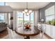 Bright dining room with a large window and access to the deck at 11857 S Saunter Ln, Parker, CO 80138