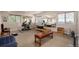 Spacious home gym with exercise equipment, natural light, and mirrors at 11857 S Saunter Ln, Parker, CO 80138