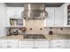 Contemporary kitchen with granite countertops, stainless steel appliances, and custom tile backsplash at 11857 S Saunter Ln, Parker, CO 80138