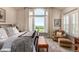 Sunlit main bedroom with large windows showcasing picturesque outdoor views at 11857 S Saunter Ln, Parker, CO 80138