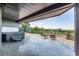 This spacious patio features a hot tub, basketball court and a cozy outdoor seating area at 11857 S Saunter Ln, Parker, CO 80138