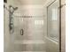 Modern tiled shower stall with glass door and chrome fixtures at 11857 S Saunter Ln, Parker, CO 80138