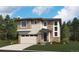 Beautiful two-story home featuring a stone and siding exterior with a two-car garage and manicured lawn at 454 S Rifle St, Aurora, CO 80017