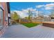 Backyard featuring a new deck, artificial turf and a hot tub at 1748 S Logan St, Denver, CO 80210