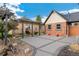A cozy backyard patio area with unique swing chairs, stylish pavers, and partial brick wall at 1748 S Logan St, Denver, CO 80210