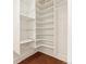 Walk-in closet featuring white shelves and wire baskets at 1748 S Logan St, Denver, CO 80210