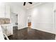 Kitchen view showing open layout, mosaic tile, and access to the laundry room with appliances visible at 1748 S Logan St, Denver, CO 80210