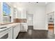Functional kitchen with white appliances, ample cabinet space, and a practical design for everyday use at 1748 S Logan St, Denver, CO 80210