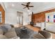 Inviting living room with exposed brick, wood floors, and an efficient stove for a cozy atmosphere at 1748 S Logan St, Denver, CO 80210