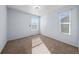 Bedroom featuring carpeted floor, windows, and neutral color scheme at 15612 E 96Th Way # 20H, Commerce City, CO 80022