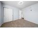 Bedroom with carpeted floor, ceiling fan, closet, and neutral color scheme at 15612 E 96Th Way # 20H, Commerce City, CO 80022