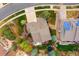 Overhead aerial shot of a home with a well-manicured lawn and solar panels at 25362 E Indore Dr, Aurora, CO 80016