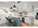 Modern bar featuring a granite countertop, stylish pendant lights, and beverage fridge at 25362 E Indore Dr, Aurora, CO 80016
