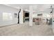 Finished basement with comfortable seating, TV, and bar area at 25362 E Indore Dr, Aurora, CO 80016