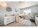 bedroom featuring a stylish bunk bed, large window, and modern furnishings at 25362 E Indore Dr, Aurora, CO 80016