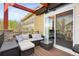 Cozy outdoor deck with wicker furniture and serene neighborhood views at 25362 E Indore Dr, Aurora, CO 80016