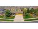 An aerial view of a two-story home with a three-car garage and well-maintained lawn at 25362 E Indore Dr, Aurora, CO 80016