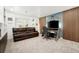 Comfortable home office with desk, seating, and natural light at 25362 E Indore Dr, Aurora, CO 80016