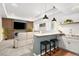 Open-concept living room and bar area with modern finishes and natural light at 25362 E Indore Dr, Aurora, CO 80016