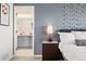 A look into the relaxing primary bedroom, with modern decor and an en suite bathroom at 25362 E Indore Dr, Aurora, CO 80016