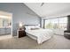 Comfortable primary bedroom with a large window providing natural light and a view of the outdoors at 25362 E Indore Dr, Aurora, CO 80016