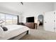 Spacious main bedroom featuring a large window, seating area, and access to en suite bath at 25362 E Indore Dr, Aurora, CO 80016