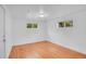 Bedroom featuring wood floors and windows at 113 E Saint Clair Ave, Longmont, CO 80504