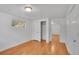 Bedroom with wood floors, closet, and natural light from a window at 113 E Saint Clair Ave, Longmont, CO 80504
