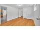 Bedroom featuring wood floors and view to kitchen at 113 E Saint Clair Ave, Longmont, CO 80504