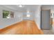 Entryway featuring light-colored hardwood flooring and storage nook, with stainless steel appliances nearby at 113 E Saint Clair Ave, Longmont, CO 80504