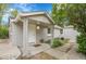 Inviting front porch with decorative supports, manicured landscaping, and clear house number at 113 E Saint Clair Ave, Longmont, CO 80504
