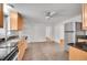 Modern kitchen with stainless steel appliances, granite countertops, and tile flooring at 113 E Saint Clair Ave, Longmont, CO 80504