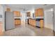 Bright kitchen featuring stainless steel appliances, wood cabinets, and durable tile flooring at 113 E Saint Clair Ave, Longmont, CO 80504