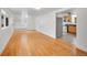 Open concept living room with hardwood flooring, custom storage nook, and easy access to the kitchen at 113 E Saint Clair Ave, Longmont, CO 80504