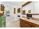 Bathroom with vanity and decorative mirror at 8475 W 74Th Dr, Arvada, CO 80005
