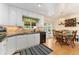 Modern kitchen and breakfast nook with stainless steel appliances and updated cabinetry at 8475 W 74Th Dr, Arvada, CO 80005