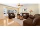 Inviting living room with hardwood floors, bay window, and comfortable seating at 8475 W 74Th Dr, Arvada, CO 80005