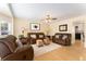 Bright living room featuring hardwood floors, plush seating, and stylish decor at 8475 W 74Th Dr, Arvada, CO 80005