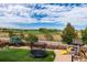 Large backyard with trampoline, playset, and plenty of space for recreation at 11877 W Yale Pl, Lakewood, CO 80228