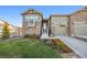 Craftsman style home with attractive landscaping and two-car garage at 7870 Slate River St, Littleton, CO 80125